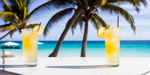 A yellow cocktail in a glass on a white table against the background of a sea beach on a bright sunny day under palm trees. Generative AI.