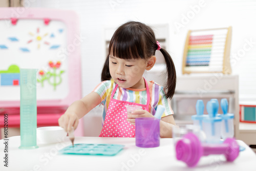 young girl making sweet gems for homeschooling