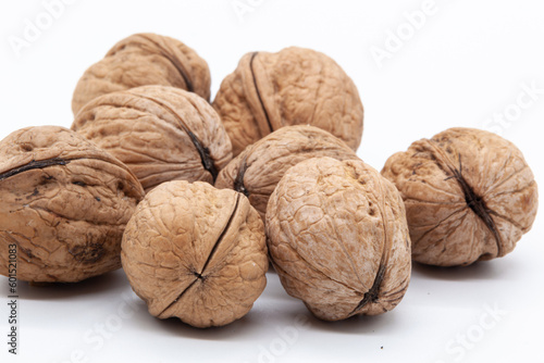 Handful of walnuts on a white background