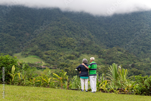 Unrecognizable senior couple looking at nature during travel to cloud forest, Mindo cloud forest, Quito, Ecuador.