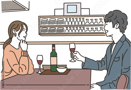 飲食店でワインを飲む男女のカップル
