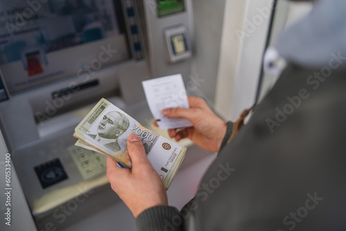 A close up of man hand holding money dinars  photo