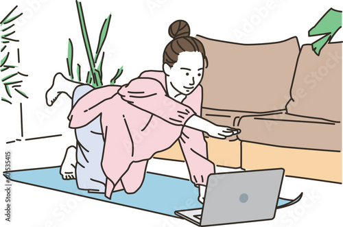 オンラインでヨガレッスンを受ける若い女性
