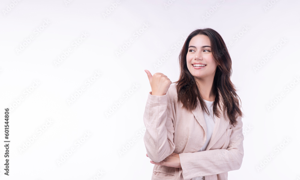 Cheerful cool woman holding thumbs up pointing presenting goods copy space smiling over isolated white background.Positive joyful teenage wear suit point backwards with thumb advertising product empty Cheerful cool woman holding thumbs up pointing presenting goods copy space smiling over isolated white background.Positive joyful teenage wear suit point backwards with thumb advertising product empty