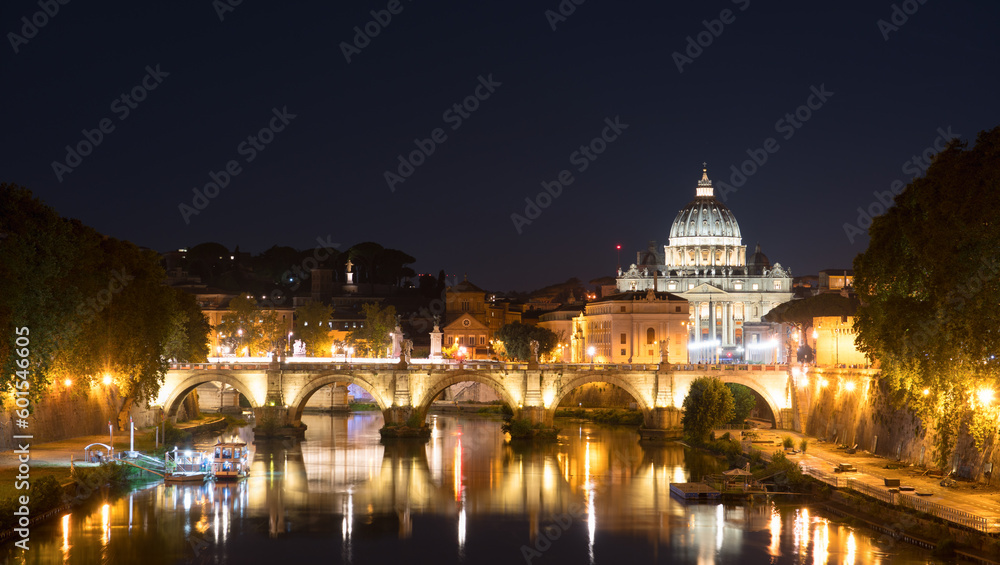 Sant' Angelo Bridge and St. Peter's cathedral at night in Vatican City, Rome. Italy