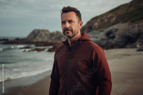 Lifestyle portrait photography of a pleased man in his 40s wearing a comfortable tracksuit against an island or beach paradise background. Generative AI