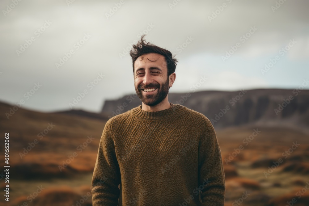 Portrait of a handsome young man with beard in the mountains. Portrait of a handsome young man with beard in the mountains.