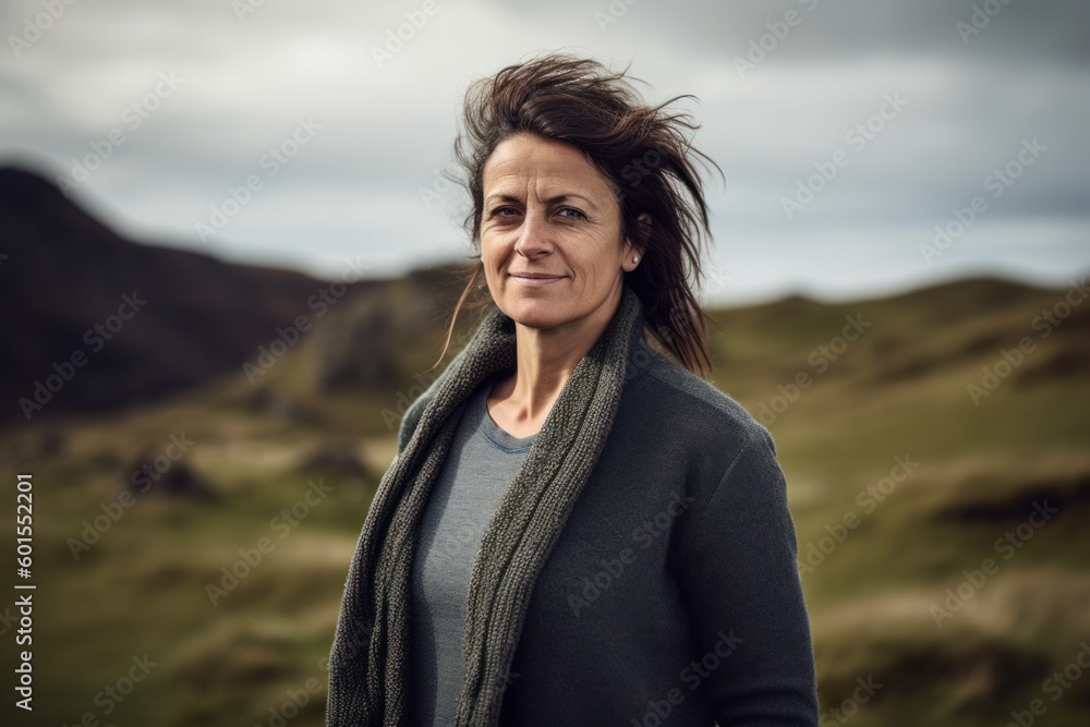 Portrait of a beautiful middle aged woman with wind blowing her hair Portrait of a beautiful middle aged woman with wind blowing her hair