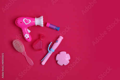acessórios para bebe menina em fundo rosa © Alexandre