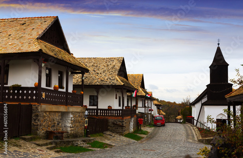 Rural landscape of tourist hungarian village Holloko with old wooden church photo