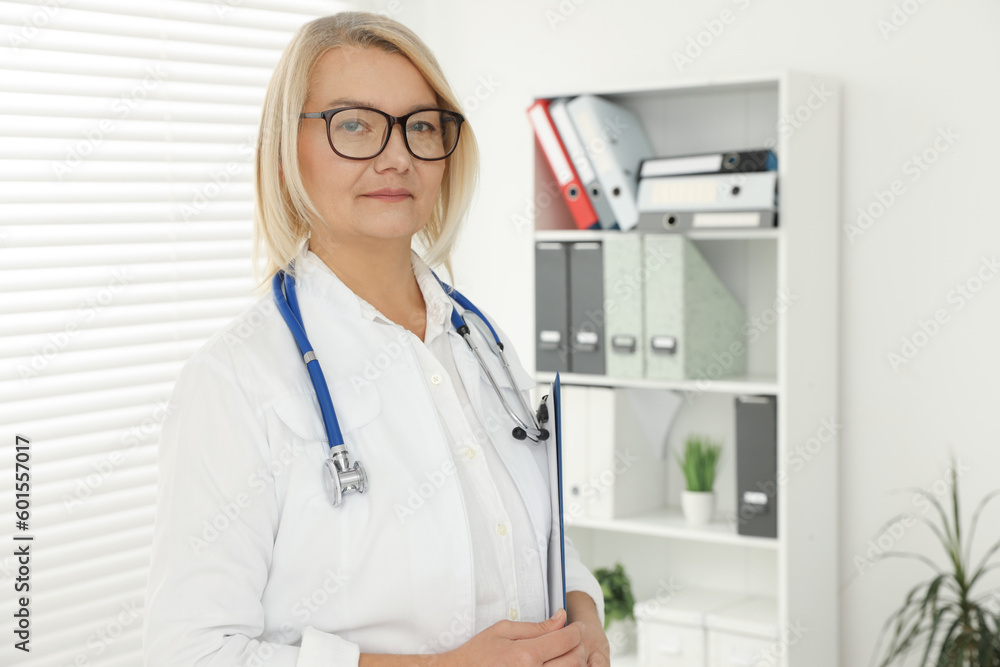 Professional doctor in uniform with stethoscope in clinic Professional doctor in uniform with stethoscope in clinic