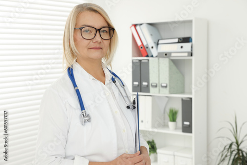 Professional doctor in uniform with stethoscope in clinic