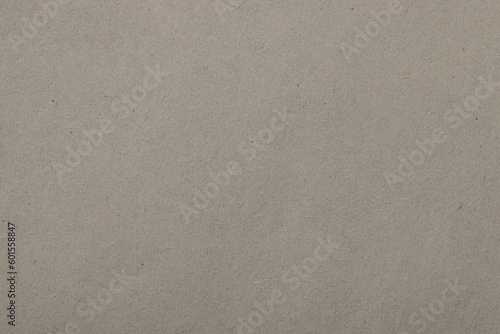 Texture of light grey paper sheet as background, top view