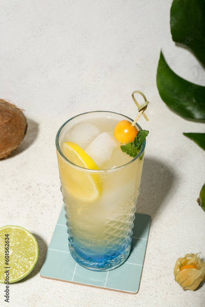 Fototapeta premium Fresh summer cocktail with lemon, winter cherry and mint on white grunge background