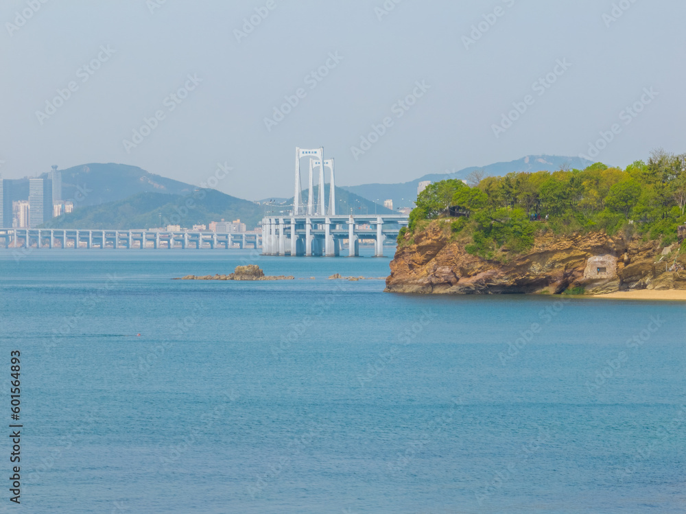 Fototapeta premium Spring seaside scenery of Binhai Road in Dalian, Liaoning province, China