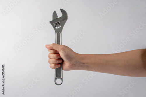 a wrench in hand isolated on white background.