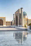 The Sher-Dor Madrasah reflected in wet floor, Samarkand