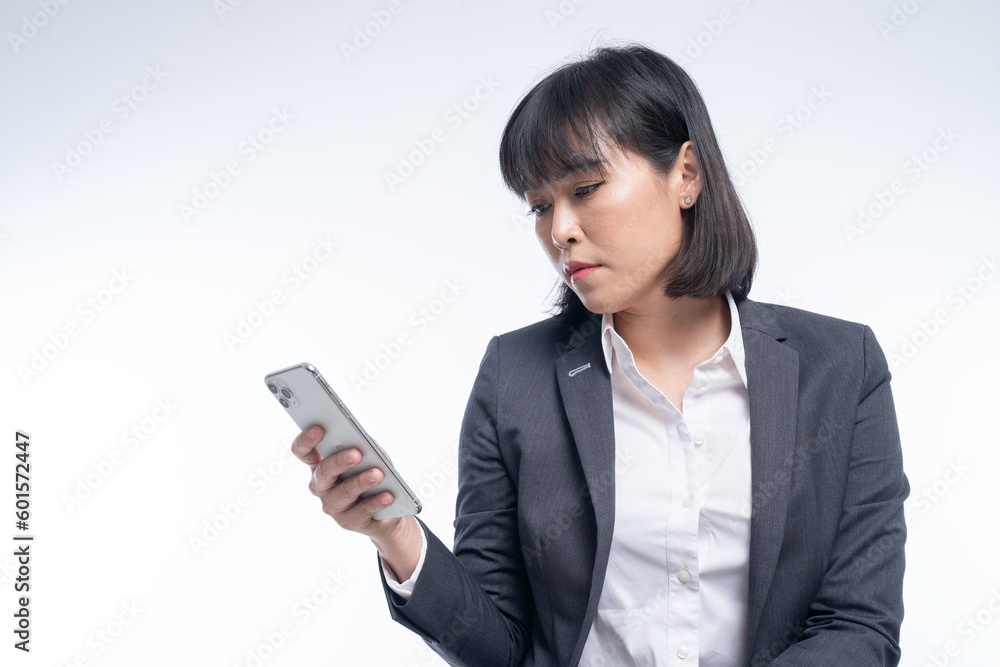 working woman wearing a suit is using a smartphone working woman wearing a suit is using a smartphone