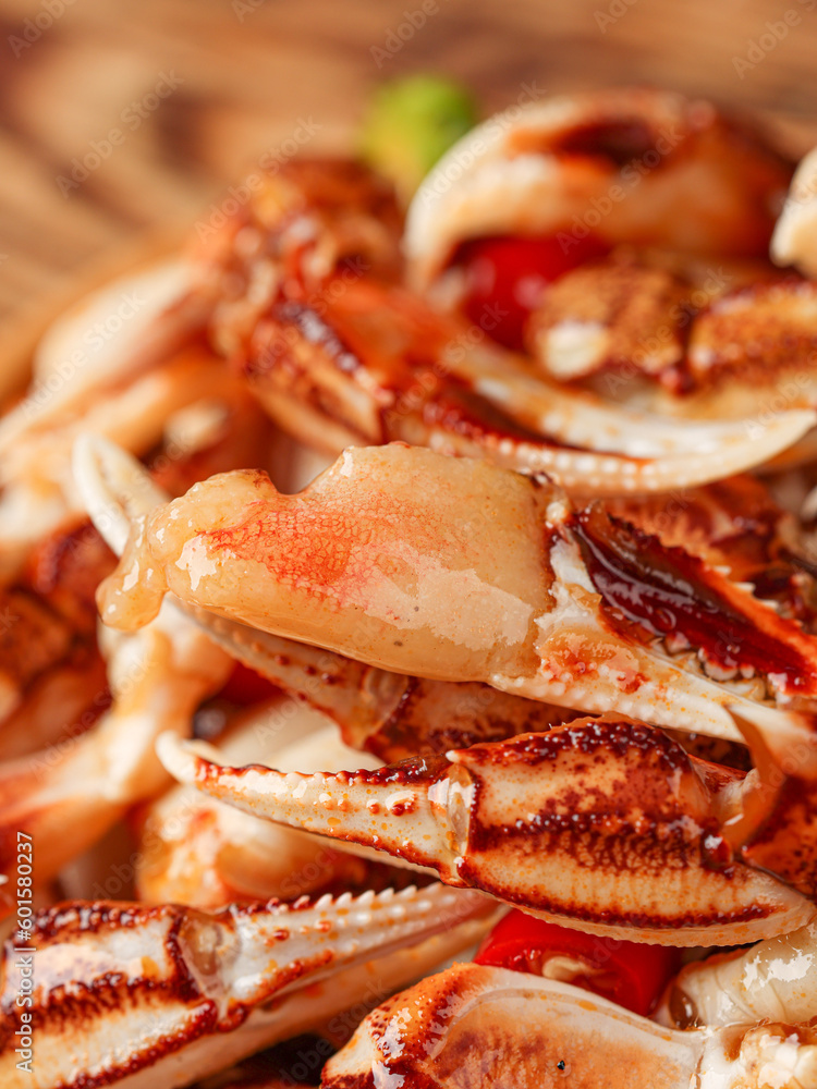 The claws of crabs are on the dining table(Lobster Claws), pincers,a delicacy marinated with spices, Chinese food The claws of crabs are on the dining table(Lobster Claws), pincers,a delicacy marinated with spices, Chinese food