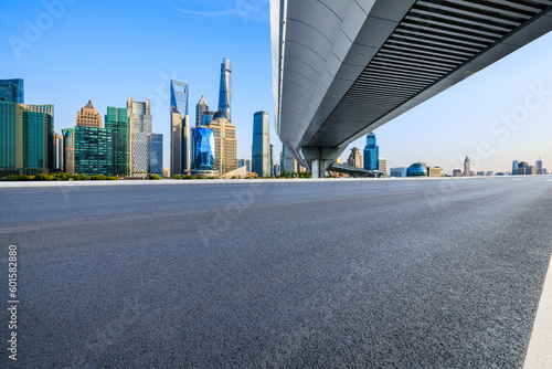 Asphalt road and bridge with city skyline scenery in Shanghai, China.