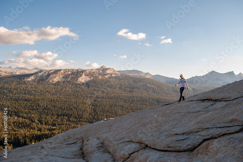 Woman walking down Lembert Dome in Yosemite National Park