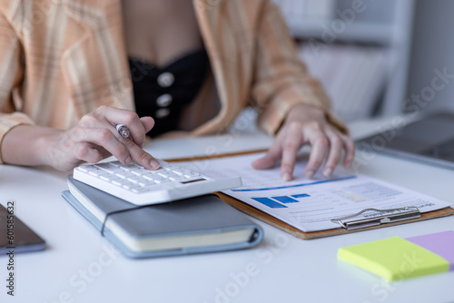 Businessman working at office with documents on his desk, doing planning analyzing the financial report, business plan investment, finance analysis concept 