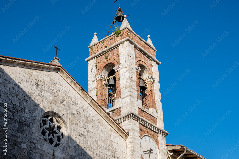 Bell Tower of San Francesco church in the medieval village of San Quirico d'Orcia, Tuscany region in central Italy, Europe