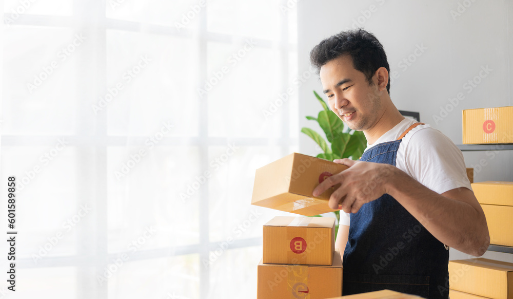 Online digital business is a new start-up small business nowadays for young Asian online shops stay at home delivering to customers. The concept of SME entrepreneurs sending parcels Online digital business is a new start-up small business nowadays for young Asian online shops stay at home delivering to customers. The concept of SME entrepreneurs sending parcels