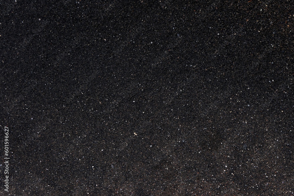Fototapeta premium Black sand texture. Background and texture for graphic design or wallpaper.