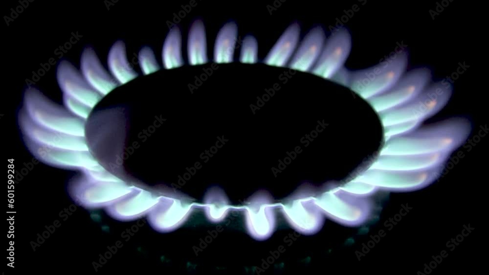 The gas burner flashes and fades in the dark The gas burner flashes and fades in the dark