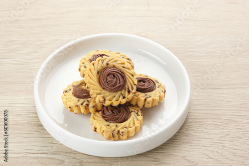 Chocolate Butter Cookies, popular cookies for Eid celebrations in Indonesia. Served in white plate 
