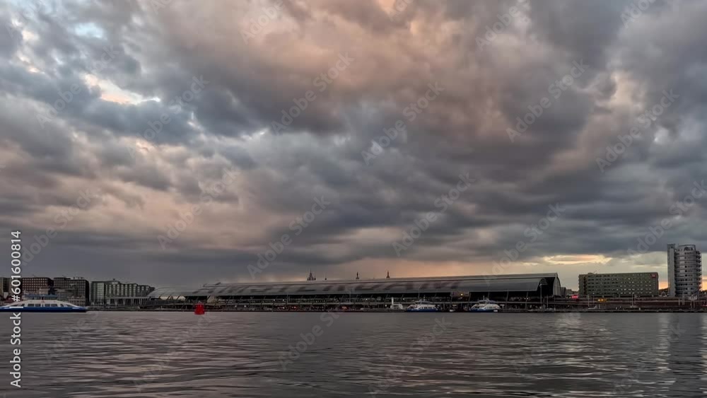 Zooming timelapse video about the river of Amsterdam. Central station on the background. Epic clouds are on the sky. Zooming timelapse video about the river of Amsterdam. Central station on the background. Epic clouds are on the sky.