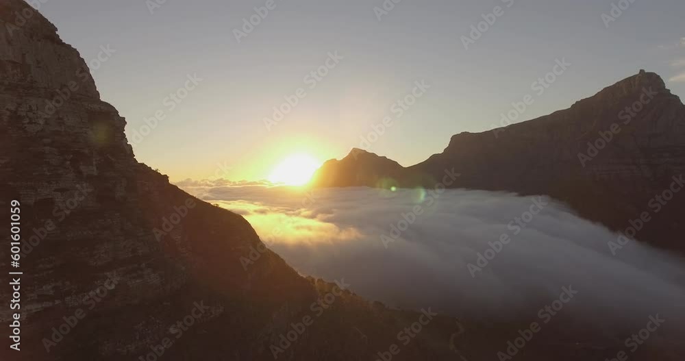 Drone shot during sunrise looking over the Table mountain and Lions Head Mountain in Cape Town South Africa with clouds in the valley on a sunny morning LOG Drone shot during sunrise looking over the Table mountain and Lions Head Mountain in Cape Town South Africa with clouds in the valley on a sunny morning LOG