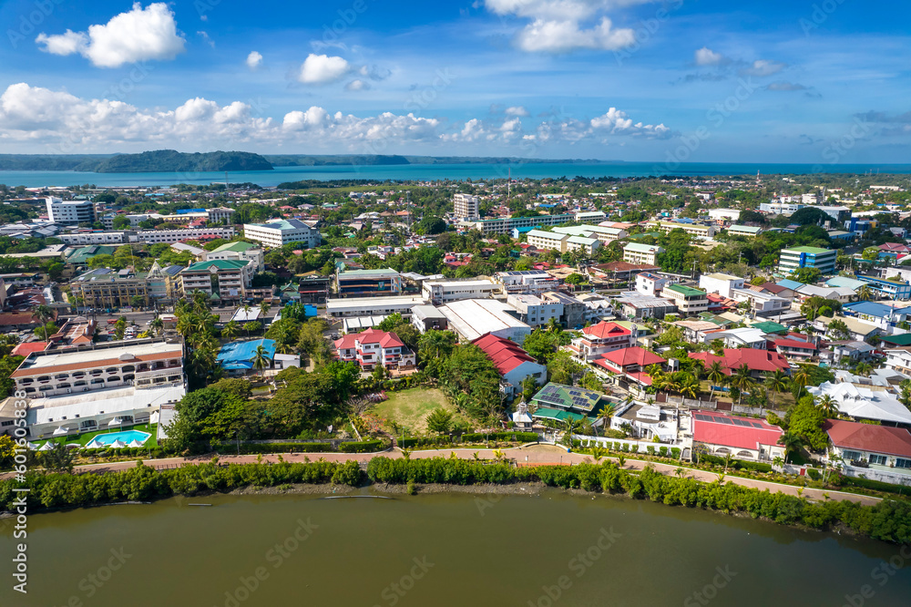 Iloilo City, Philippines - Aerial of the Molo district of Iloilo, with the island of Guimaras in the distance.