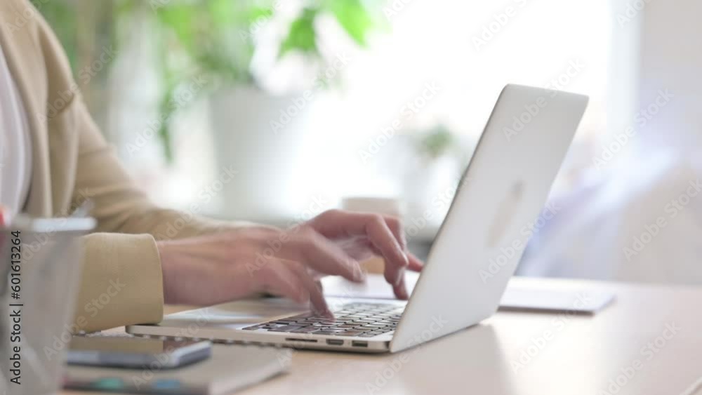 Side View of Businessman Working on Laptop Side View of Businessman Working on Laptop