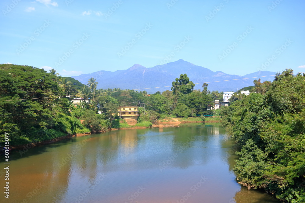 View from the top of the Kuttyady (Kuttiady, Kuttyadi) bridge to the river and Mountains, Khozikode, Kerala, India