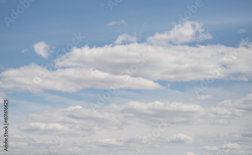 Fototapeta Naklejka Na Ścianę i Meble -  blue sky with white fluffy clouds against the sky