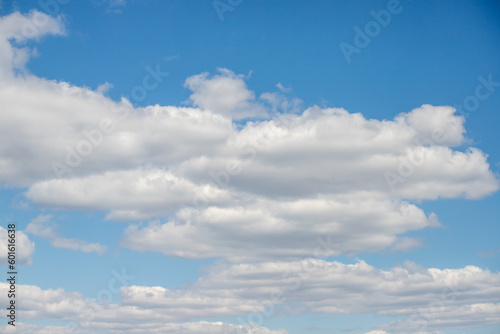 blue sky with white fluffy clouds against the sky