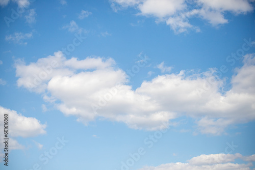 Fototapeta Naklejka Na Ścianę i Meble -  blue sky with white fluffy clouds against the sky