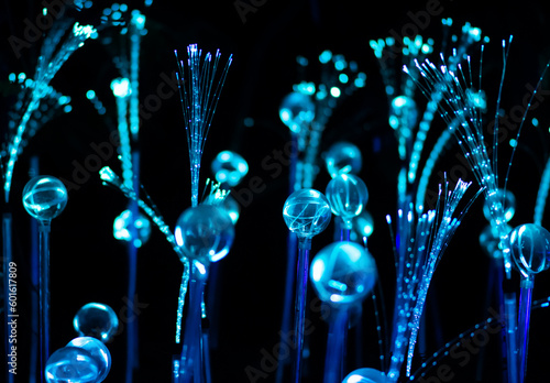 Blue fiber or fibre optic strands or filaments creating a magic fantastic abstract background, AI artificial intelligence or virtual reality concept