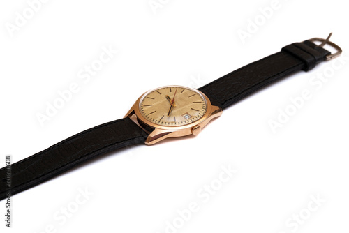 Golden wrist watch on a white background, vintage watch from the times of the ussr