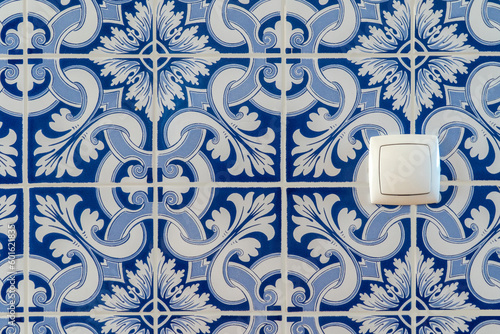 Portuguese traditional tiles background. Retro old vintage wall blue tiles. House in Portugal interior style hydraulic ceramic mosaic tiles.