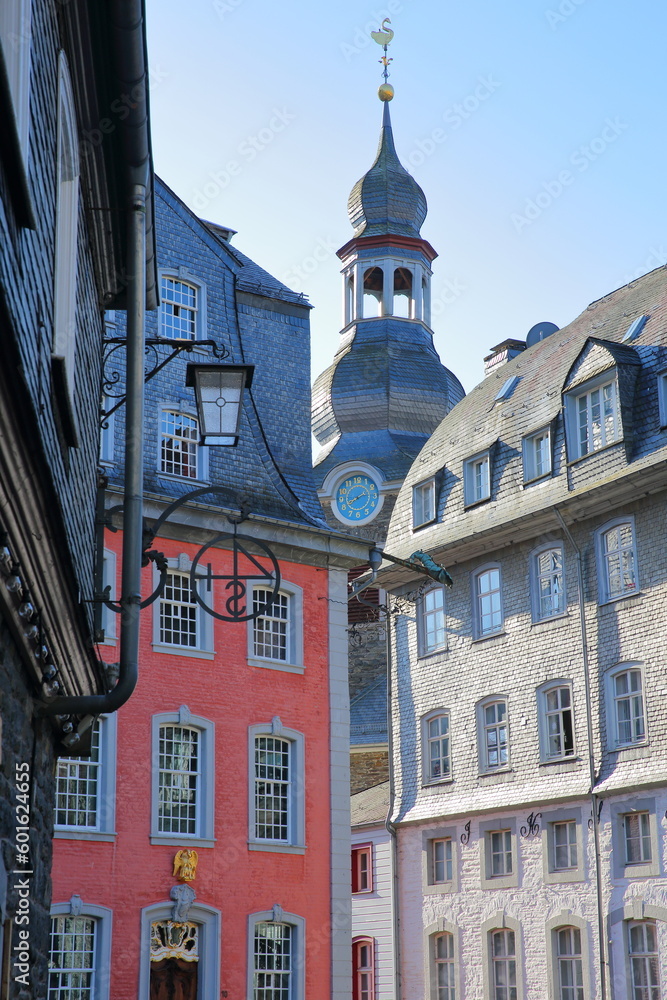 The historical center of the medieval town of Monschau, North Rhine Westfalia, Germany, with half timbered houses and the bell tower of the Evangelical City Church