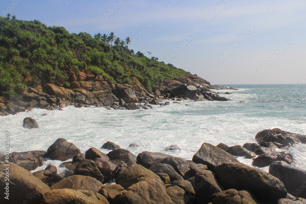 The mound of stones on the seashore. Sri Lanka, blue sky, copy space for text