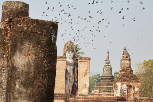 The elaborate Buddhist temple of Wat Mahathat in the historic city of Sukhothai, Thailand photo