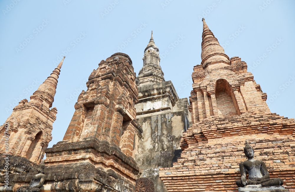 The elaborate Buddhist temple of Wat Mahathat in the historic city of Sukhothai, Thailand The elaborate Buddhist temple of Wat Mahathat in the historic city of Sukhothai, Thailand