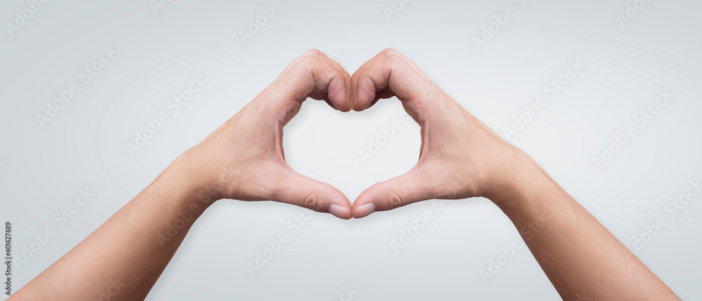 Fototapeta premium hands forming a heart on a white background