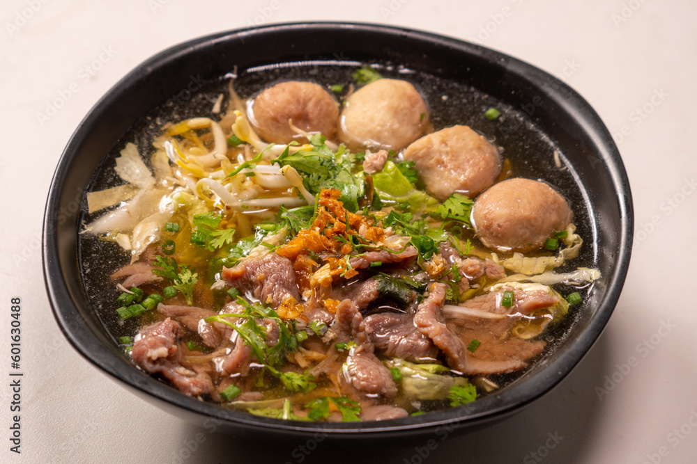 Chinese clear soup with boiled entrails and vegetables and meat ball