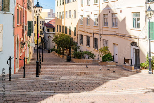 View of a narrow street lined with colorful houses in Gibraltar, UK