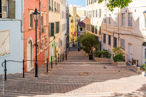 View of a narrow street lined with colorful houses in Gibraltar, UK